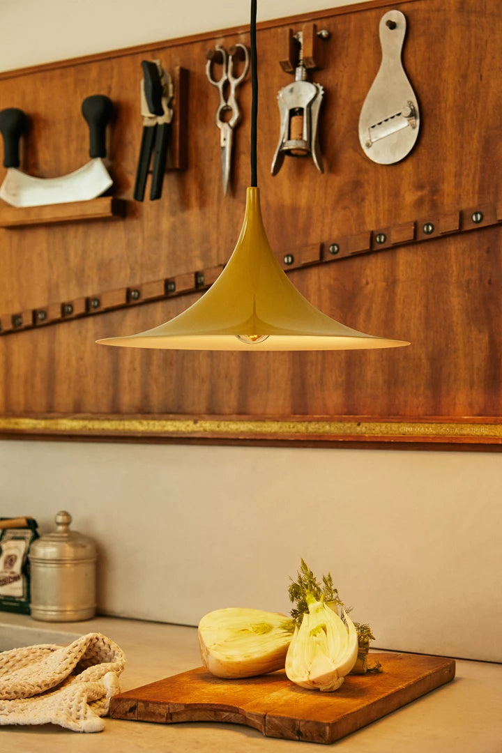 Black Gubi semi pendant light, 30cm diameter, modern lighting fixture with matte finish, designed for stylish interior illumination.