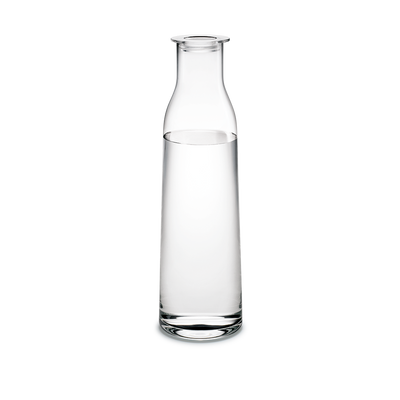 Holmegaard Minima bottle with lid, clear glass accessory for storing liquids, featuring a sleek minimalist design and transparent finish.