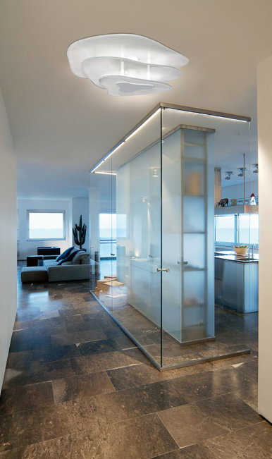 Itama Smoke wall and ceiling light fixture with a modern smoked glass design, ideal for contemporary lighting in living spaces.