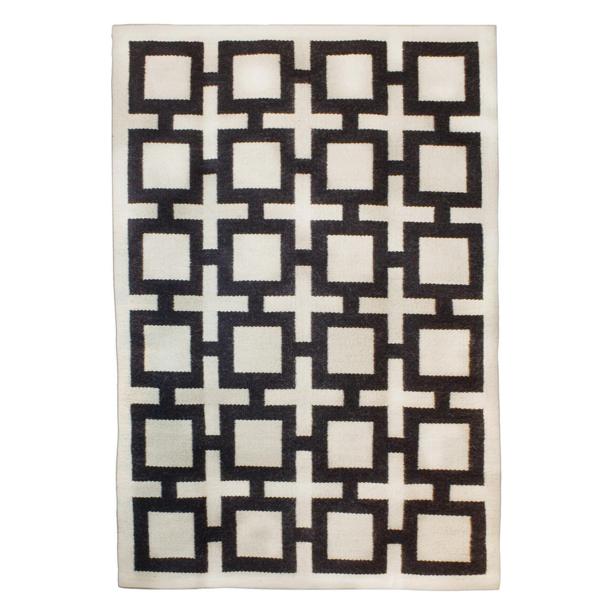 Jonathan Adler Nixon reversible rug, black and patterned, accessory for home decor, showcasing its reversible design and stylish pattern.