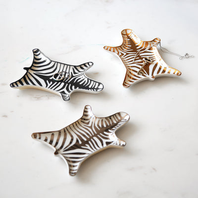 Black zebra stacking dishes by Jonathan Adler, stylish accessories featuring bold zebra print and modern design.