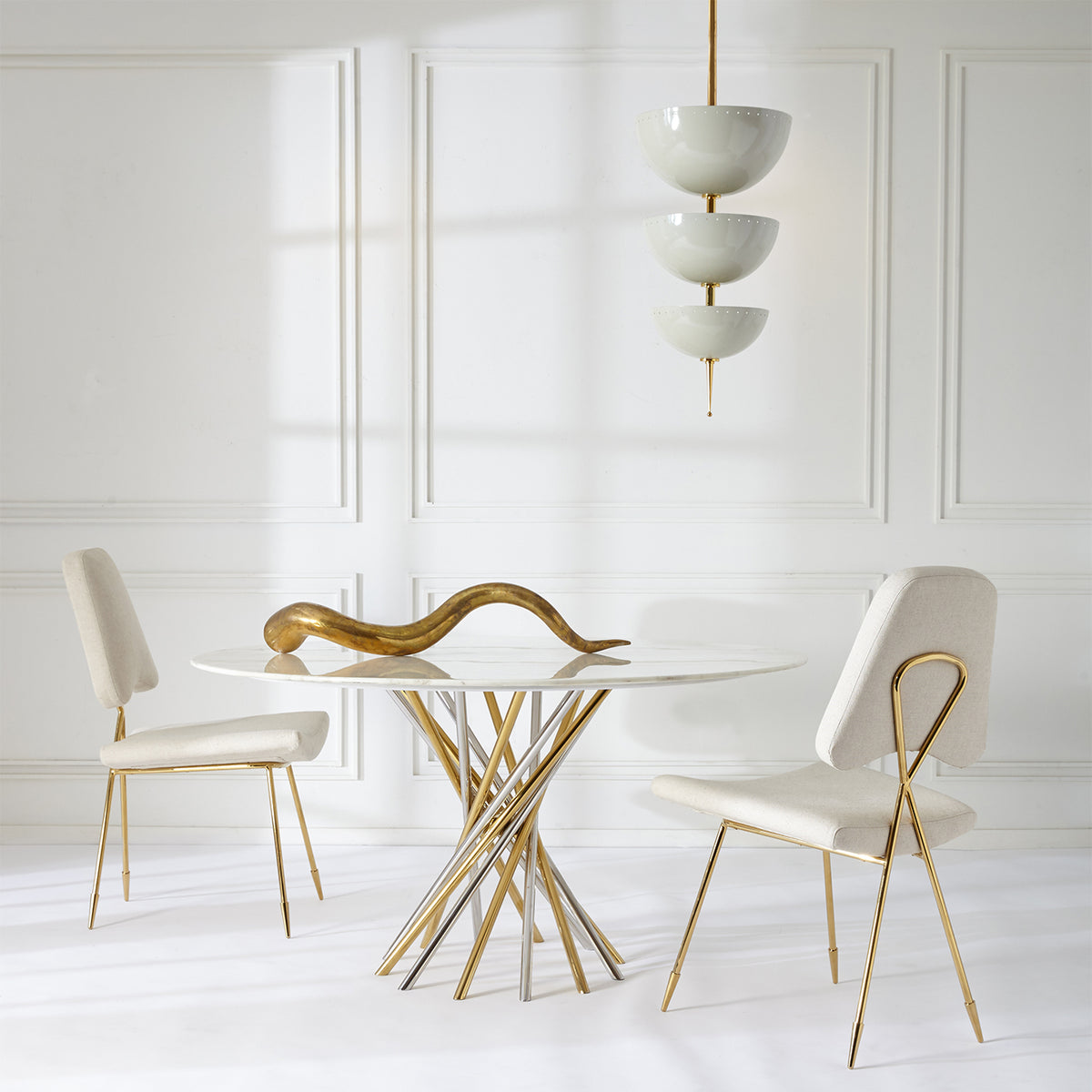 Brass giant horn sculpture by Jonathan Adler, a stylish accessories piece with a shiny, curved design.