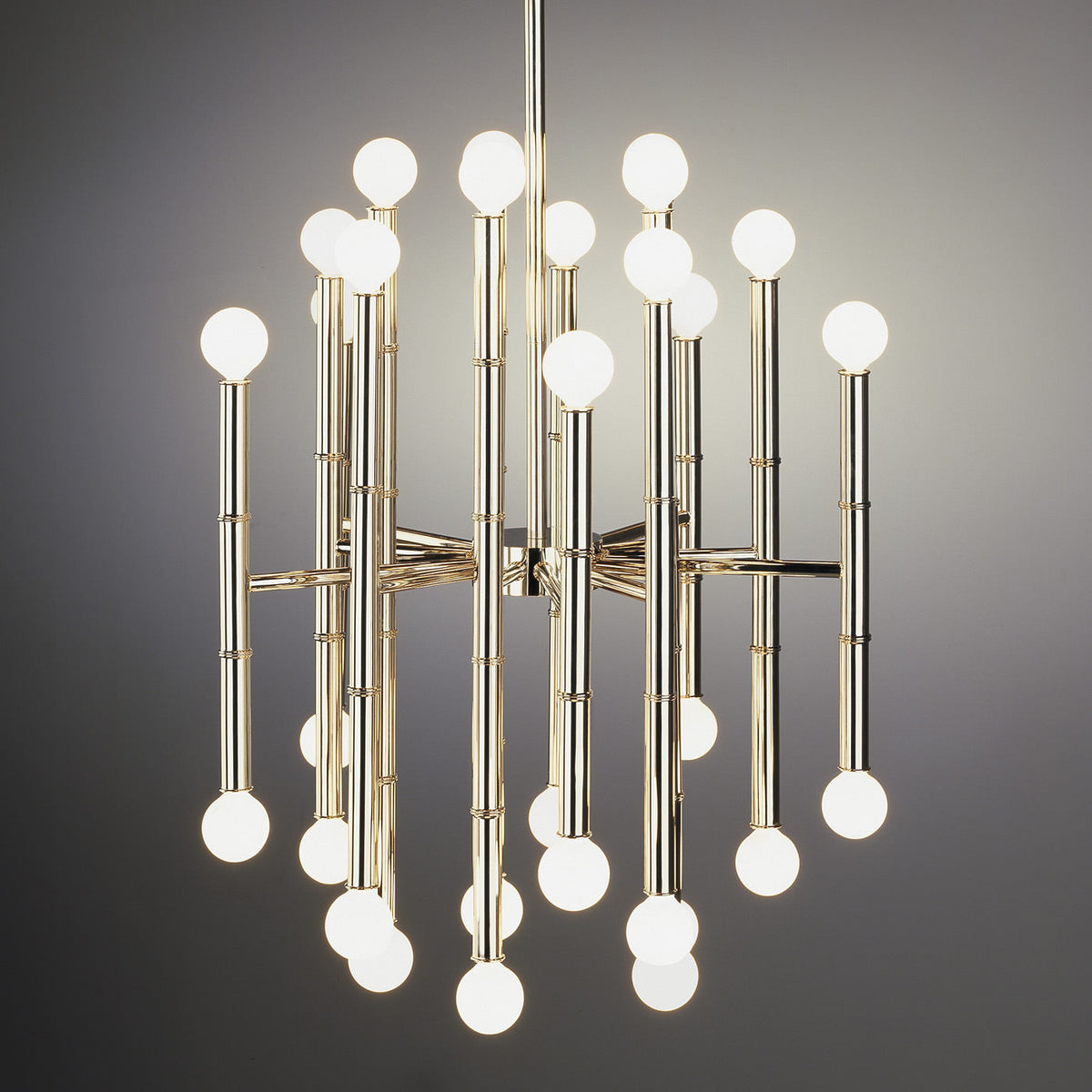 Brass Meurice Chandelier by Jonathan Adler hanging with multiple light bulbs and decorative details in a modern lighting fixture.