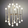 Brass Meurice Chandelier by Jonathan Adler hanging with multiple light bulbs and decorative details in a modern lighting fixture.