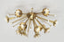 Polished nickel Sputnik flush mount ceiling light by Jonathan Adler with multiple light arms radiating outward.