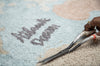 Kids' vintage map washable rug by Lorena Canals featuring colorful map design, soft and durable for children's rooms.
