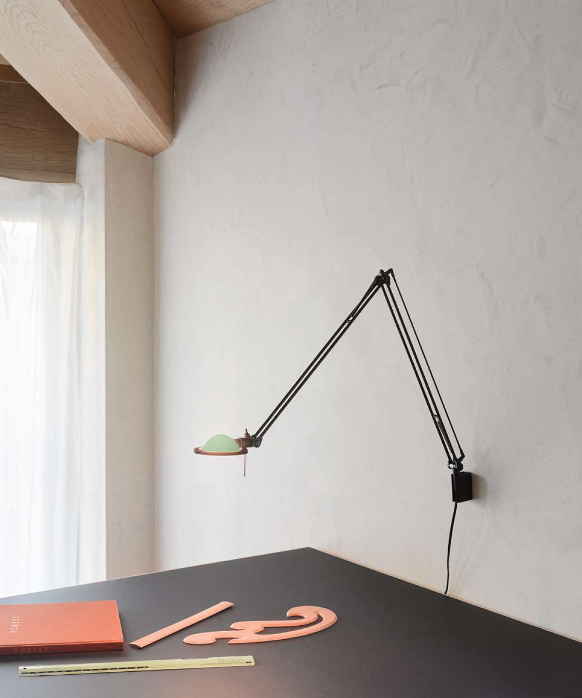 Luceplan Berenice wall lamp with sleek aluminum design, modern lighting fixture mounted on a wall for contemporary interior decor.