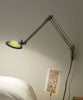 Luceplan Berenice wall lamp in sleek aluminum, modern lighting fixture mounted on wall with soft illumination