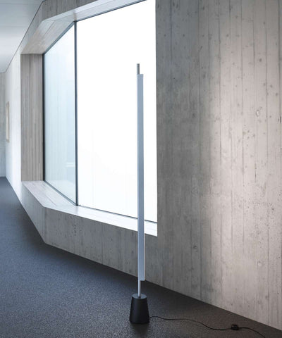 Luceplan Compendium Floor Lamp with aluminum stand and adjustable lighting, featuring a sleek modern design for contemporary interiors.