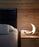 Luceplan Curl Table lighting with sleek, modern design featuring a curved glass shade and minimalist base.