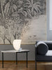 Luceplan Curl Table lighting with sleek, modern design featuring a curved metal base and a round, illuminated tabletop.