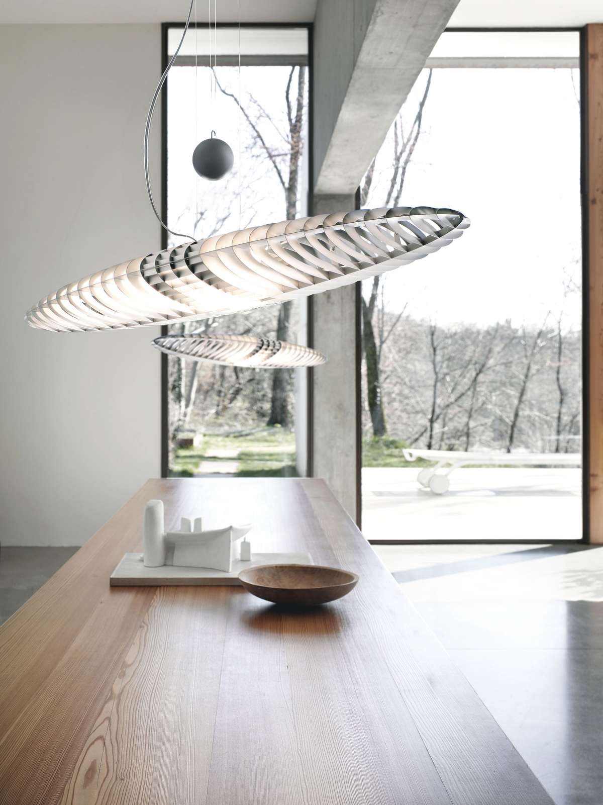 Luceplan Titania Suspension Lamp hanging with sleek, modern design and diffused lighting for contemporary interiors.