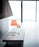 Costanza Table Lamp by Luceplan with white aluminum finish and on/off switch, modern lighting design, on a flat surface.