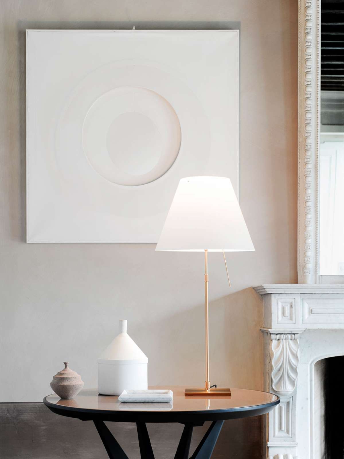 Costanza Table Lamp by Luceplan with a white aluminum finish, featuring a modern fixed W-base and on/off switch.