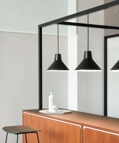 Blue Archetype Suspension Lamp by Luceplan, modern lighting fixture with sleek design and vibrant color, hanging from ceiling.