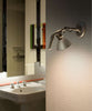 Fortebraccio wall lamp by Luceplan featuring sleek metal design and adjustable lighting for modern interior decor.