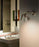 Fortebraccio wall lamp by Luceplan featuring sleek metal design and adjustable lighting for modern interior decor.