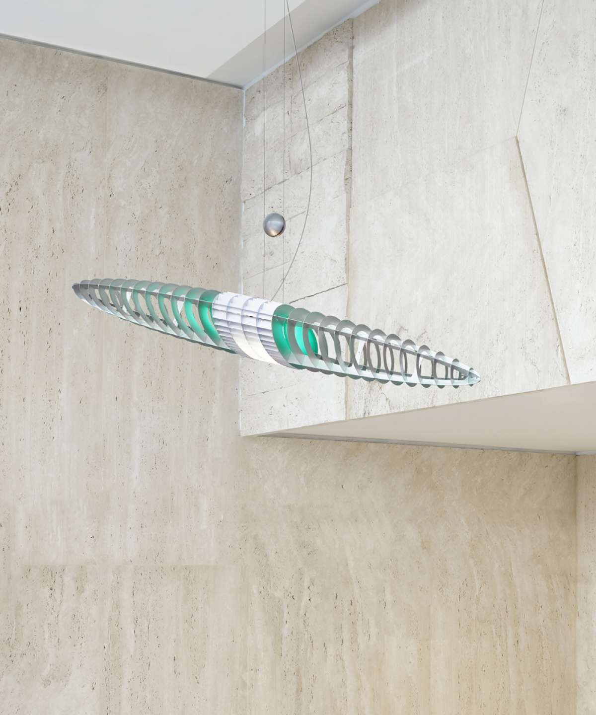 Pink Queen Titania Suspension Lamp by Luceplan hanging with a sleek, modern design and soft illumination.