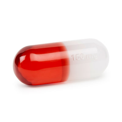 Small red acrylic pill accessory by Jonathan Adler, featuring a clear lucite design with "150mg" inscription.