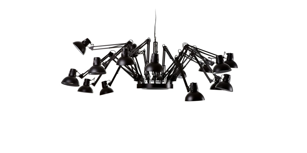 Black Dear Ingo suspension lamp by Moooi, modern lighting fixture with sleek design, hanging from a ceiling with visible cords.