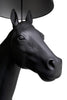 Horse floor lamp by Moooi featuring a whimsical horse-shaped lighting sculpture in a modern interior setting.
