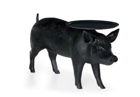 Moooi Pig Side Table featuring a whimsical pig-shaped design, made of smooth material, perfect as a decorative accent table.