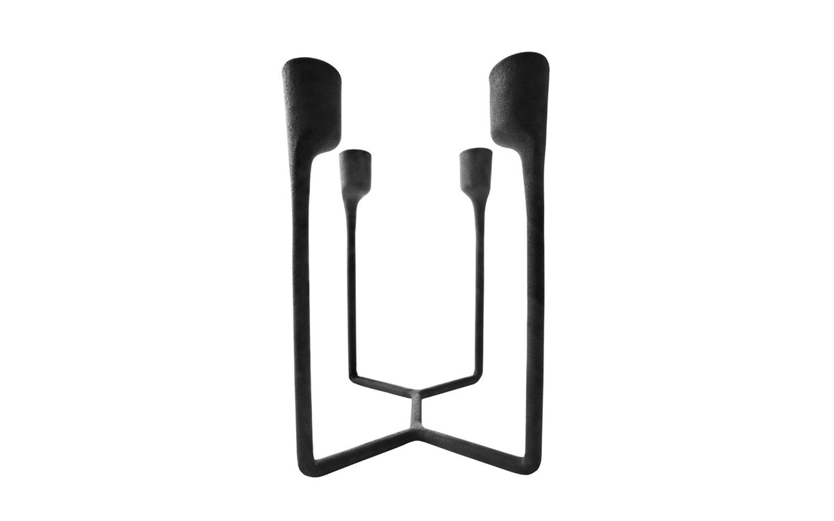 Heima 4-armed candlestick by Normann Copenhagen, modern accessory with four arms, made of matte black material for stylish decor.