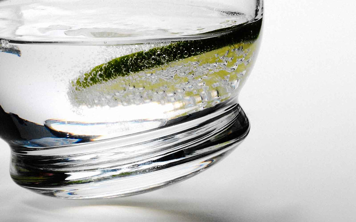 Normann Copenhagen rocking glass accessory with clear glass and rounded base, designed for stylish drinking experiences.