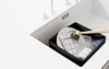 Washing-up brush by Normann Copenhagen, a stylish kitchen accessory with a wooden handle and durable bristles.