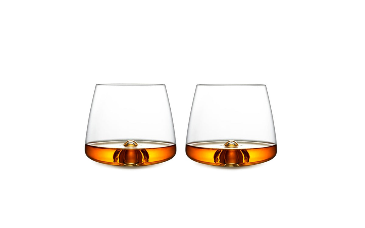 Elegant whiskey glass by Normann Copenhagen, made of clear glass, designed for enjoying fine spirits with a modern touch.