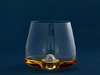 Elegant whiskey glass by Normann Copenhagen, clear glass accessory ideal for enjoying whiskey or spirits.