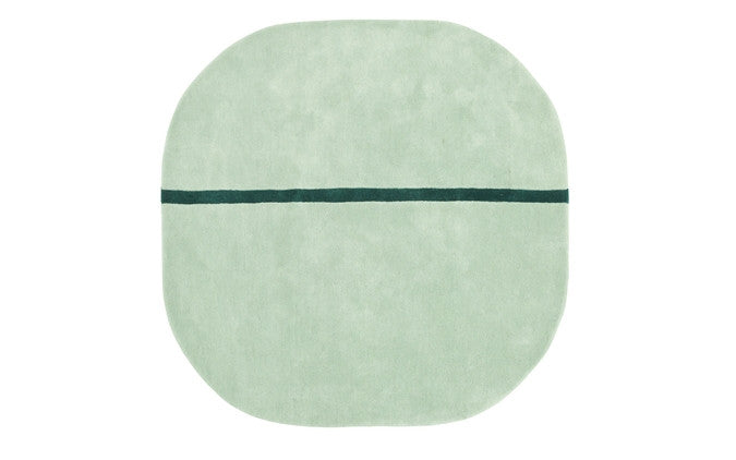 Grey Oona carpet by Normann Copenhagen, 140x140cm, shown as a soft, textured accessory with modern Scandinavian design.