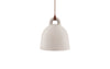 Small sand-colored Bell Lamp by Normann Copenhagen, stylish modern lighting fixture with a smooth, rounded design.