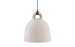 Small sand-colored Bell Lamp by Normann Copenhagen, modern lighting fixture with a sleek, rounded design.