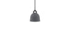 Small sand-colored Bell Lamp by Normann Copenhagen, modern lighting fixture with a smooth, rounded design.