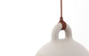 Small sand-colored Bell Lamp by Normann Copenhagen, a modern lighting fixture with a smooth, rounded design.