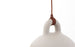 Small sand-colored Bell Lamp by Normann Copenhagen, a modern lighting fixture with a smooth, rounded design.