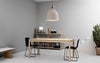 Small sand-colored Bell Lamp by Normann Copenhagen, minimalist lighting fixture with a smooth, rounded design.