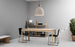 Small sand-colored Bell Lamp by Normann Copenhagen, minimalist lighting fixture with a smooth, rounded design.