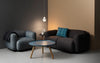 Small white Tablo coffee table by Normann Copenhagen, featuring a minimalist design with a round tabletop and slender legs.