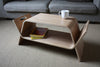 Walnut Embrace coffee and end table by Offi with sleek, modern design and smooth surface, perfect for contemporary living spaces.