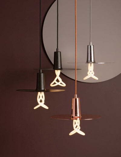 Copper Drop Hat Lamp Shade by Plumen, modern lighting fixture with a sleek, curved design, designed for stylish illumination.