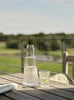 Carafe Pilastro avec verre 1 L, par Stelton