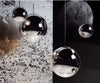 Gold mirror ball pendant light by Tom Dixon, 25cm diameter, modern lighting fixture with reflective surface.