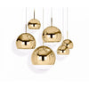 Gold mirror ball pendant light by Tom Dixon showcasing a reflective spherical lighting fixture with a sleek, modern design.