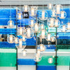 White Ilu Suspension light by Viso, a modern Canadian-made lighting fixture with a sleek design and clear glass shade.