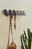Black Haak Hook by Woud Denmark, modern wall-mounted accessory with sleek design, perfect for hanging items.
